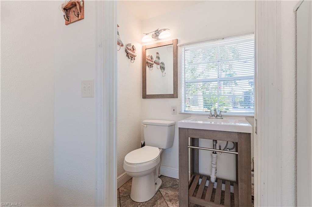 5216 Pineland Daisy Trail Fort Myers, FL 33905 - Photo 15 of 16 Half bath with baseboards and toilet