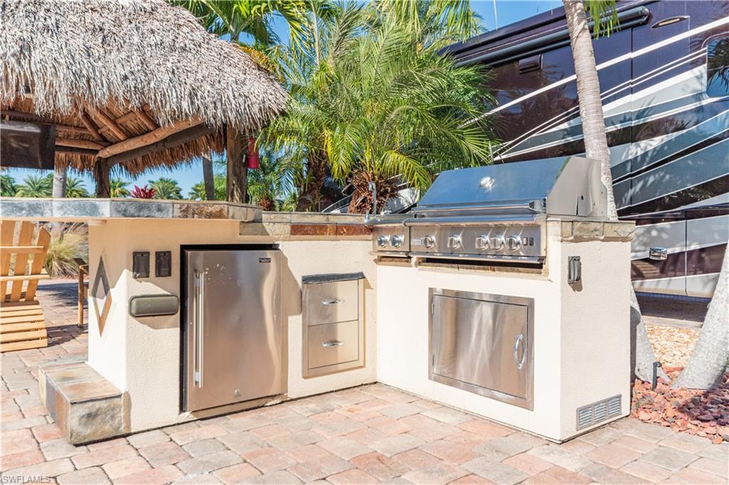 5216 Pineland Daisy Trail Fort Myers, FL 33905 - Photo 8 of 16 View of patio / terrace with exterior kitchen