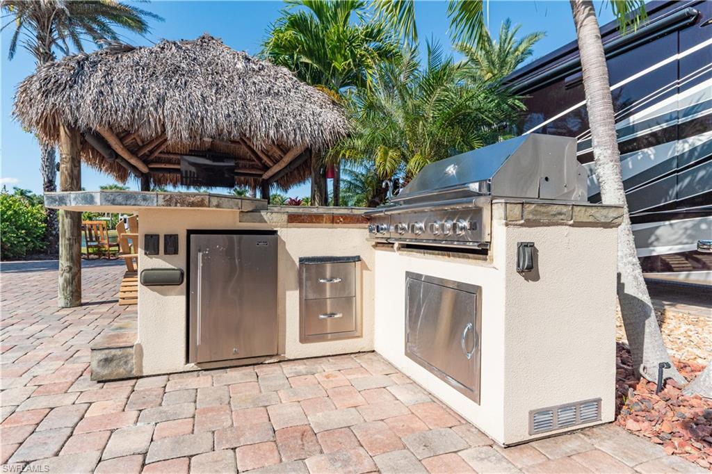 5216 Pineland Daisy Trail Fort Myers, FL 33905 - Photo 10 of 16 View of patio / terrace featuring exterior kitchen