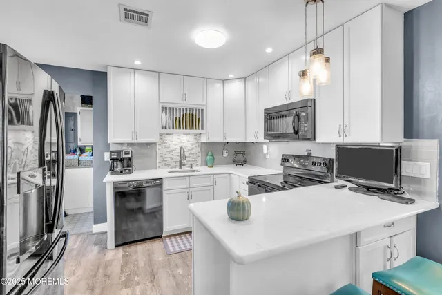 a bedroom with a bed and a television