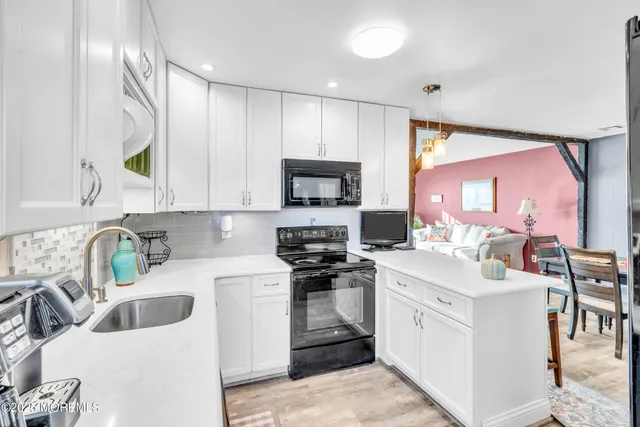 a bedroom with a bed and a television