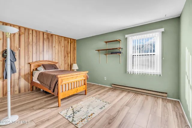 a roof deck with table and chairs potted plants with wooden floor