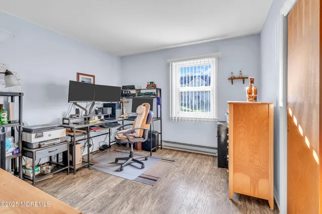 a view of outdoor seating space with furniture and wooden floor