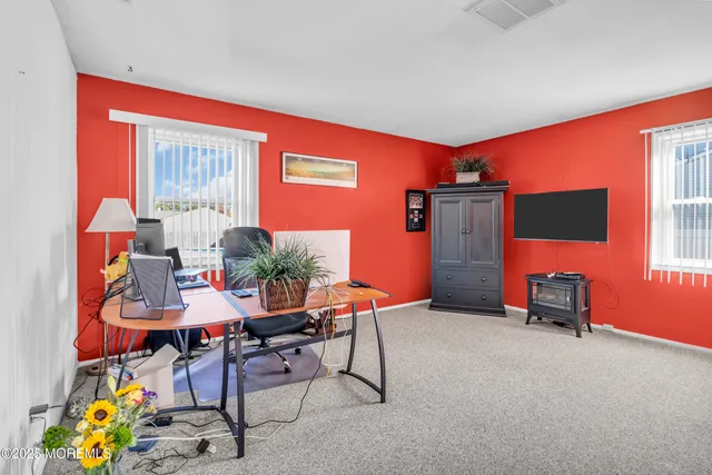 a view of a house with pool and chairs
