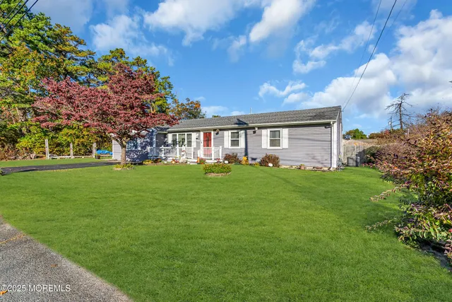 a living room with furniture a rug and a window