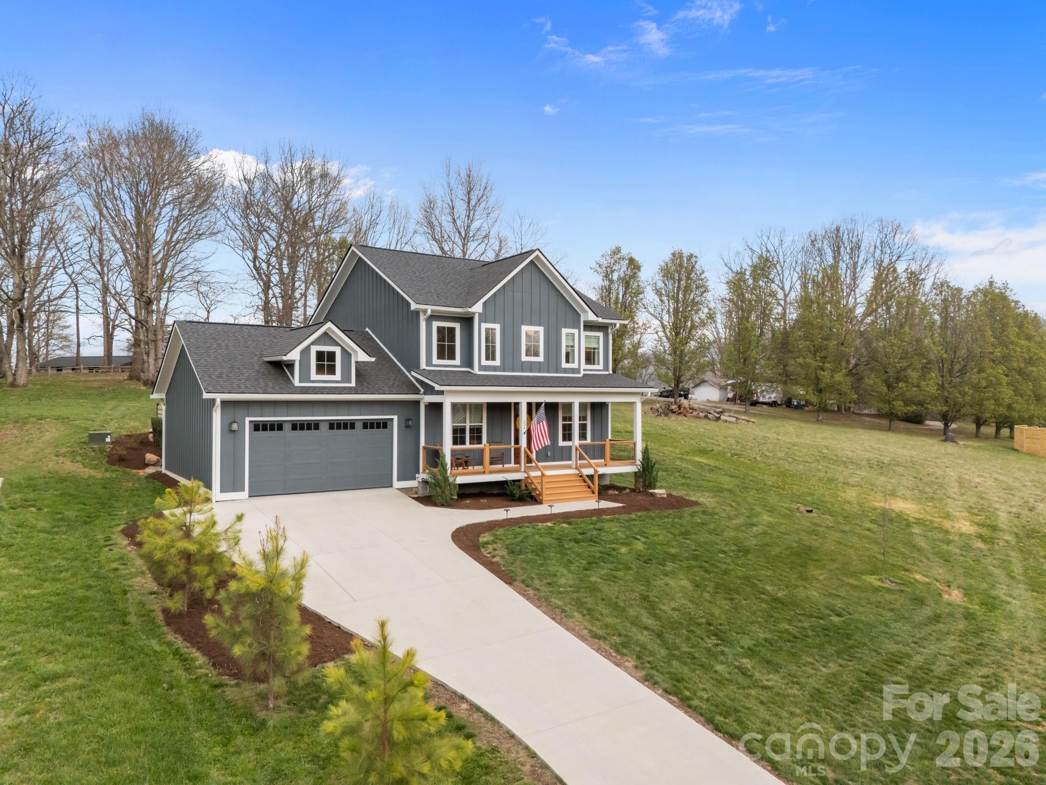 234 Gravely Branch Road Fletcher, NC 28732 - Photo 1 of 46 a front view of a house with a yard