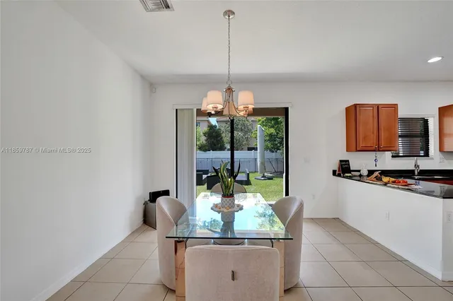 a kitchen with a sink and a refrigerator