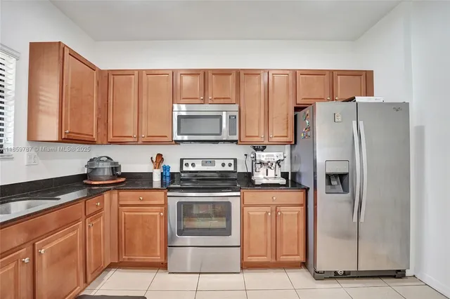 a view of a livingroom with furniture and gym equipment