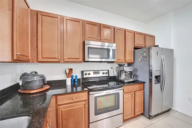 a bed room with a bed a couch and a window