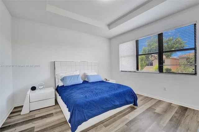a view of a couches in the patio with a small yard