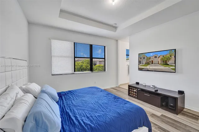 a view of a house with swimming pool and a table and chairs