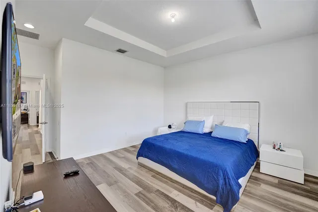 a view of a patio with table and chairs and potted plants