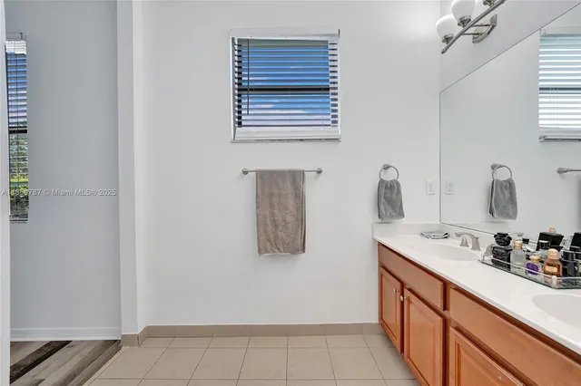 a picture of a bench in front of a white house