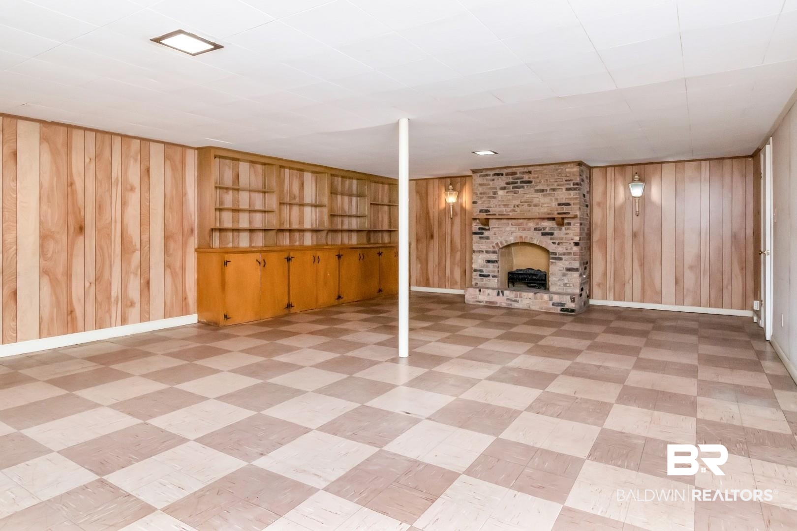 308 Brawood Drive Mobile, AL 36608 - Photo 20 of 33 Basement featuring a brick fireplace and wood walls