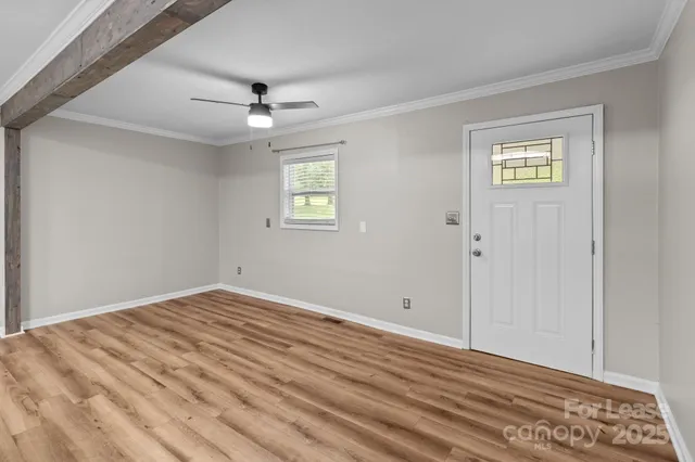 a view of an empty room with a window