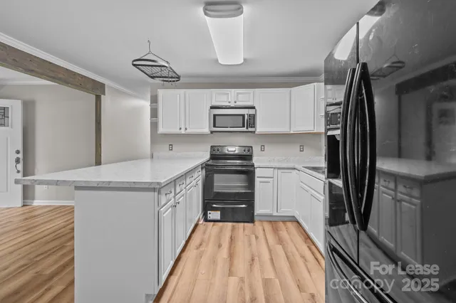 a kitchen with a refrigerator and a sink