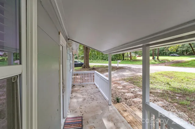 a view of a porch with wooden floor and outdoor space