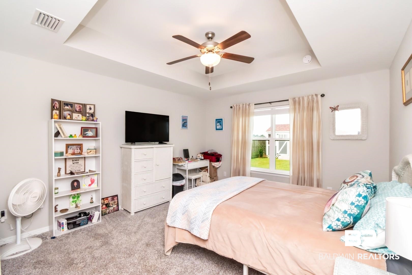 1295 Hayward Loop Foley, AL 36535 - Photo 14 of 29 Recessed ceiling with a central fan light fixture, gray carpet flooring, and a window with a green yard visible