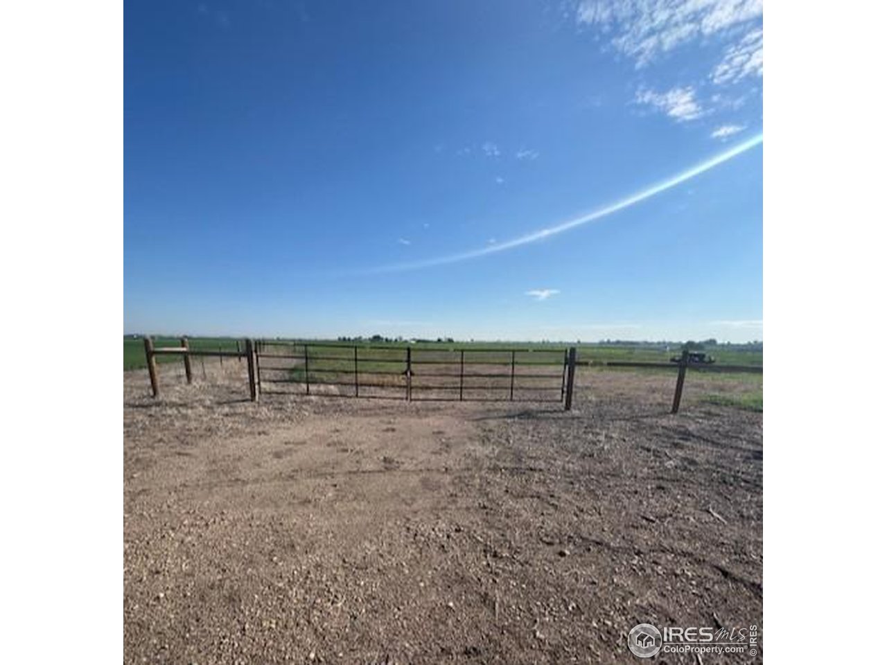 20801 County Road 72 Eaton, CO 80615 - Photo 2 of 4 a view of a dry yard with wooden fence