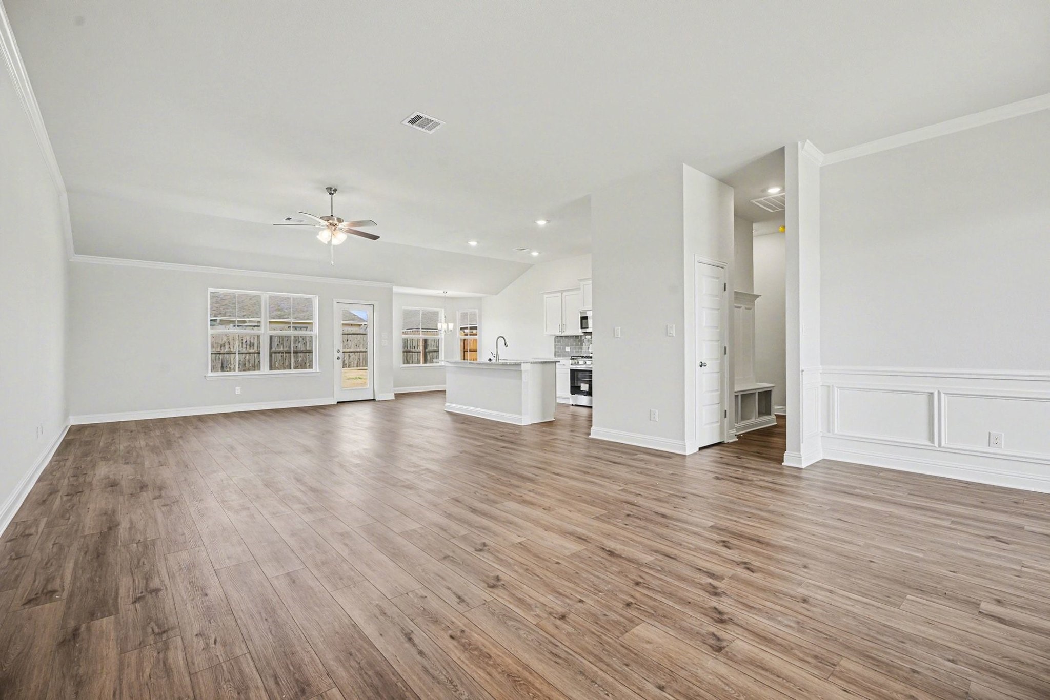 5 Keystone Court Angleton, TX 77515 - Photo 6 of 33 a view of an empty room with wooden floor and a window