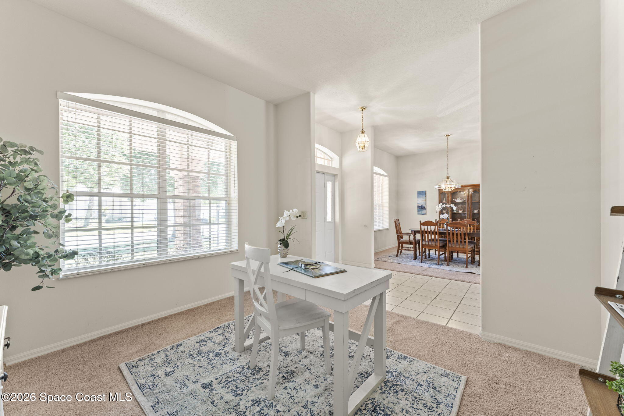 1123 Spring Oak Drive Melbourne, FL 32901 - Photo 12 of 67 a living room with furniture and a window