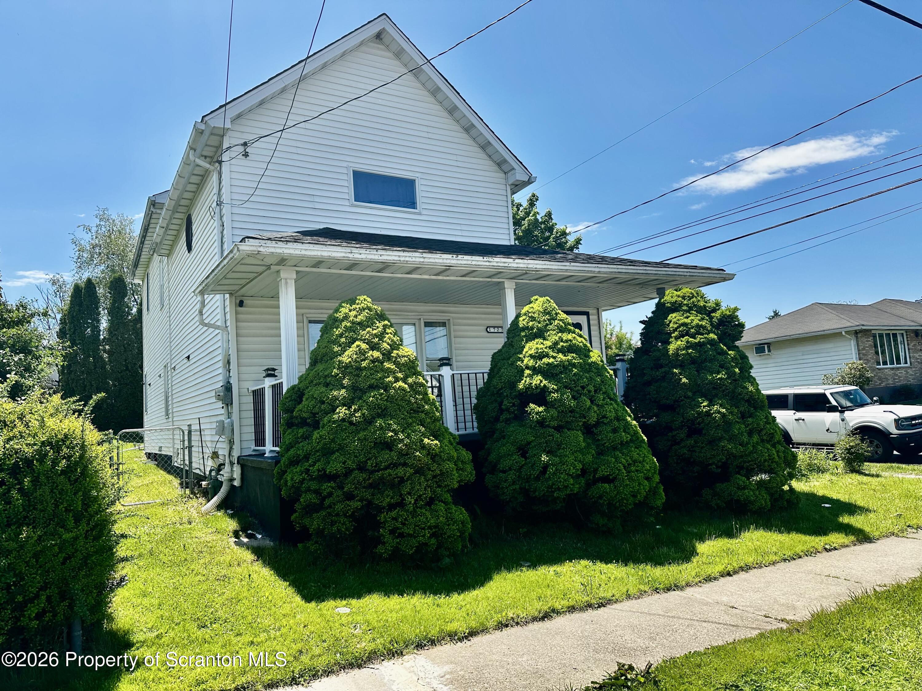 1727 Bulwer Street Scranton, PA 18504 - Photo 3 of 40 a front view of house along with yard and outdoor seating
