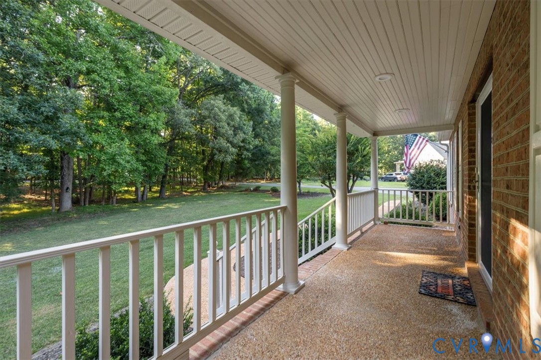 1437 Palmore Road Powhatan, VA 23139 - Photo 5 of 60 Expansive covered front porch featuring a textured