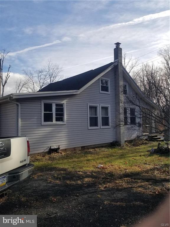 107 Rock Ridge Road Ottsville, PA 18942 - Photo 2 of 10 a view of a house with a yard