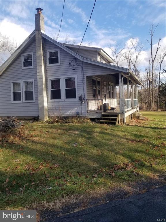107 Rock Ridge Road Ottsville, PA 18942 - Photo 3 of 10 a front view of house with yard