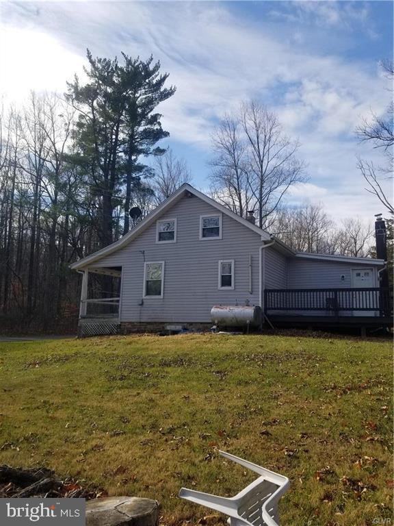 107 Rock Ridge Road Ottsville, PA 18942 - Photo 5 of 10 a view of a house with a yard