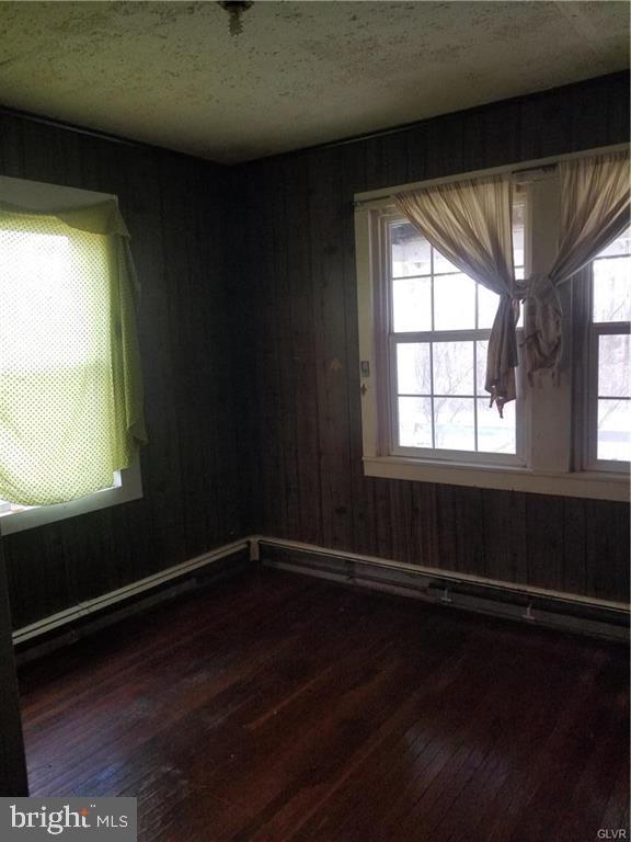 107 Rock Ridge Road Ottsville, PA 18942 - Photo 10 of 10 a view of an empty room with wooden floor and a window