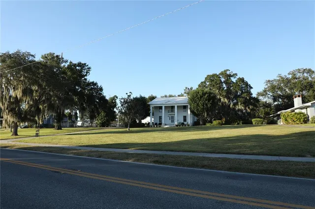 a view of a big yard in front of a house