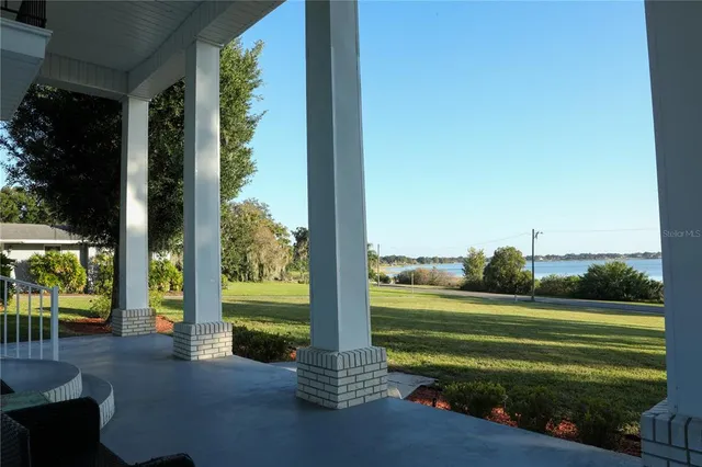 a view of a park with big trees