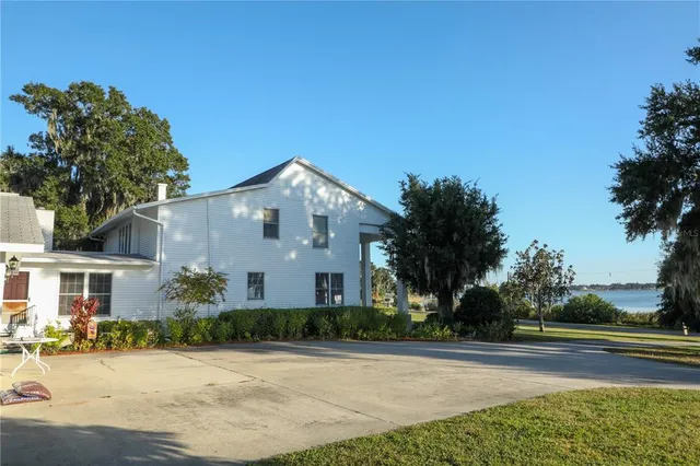 a view of a house with a yard and plants