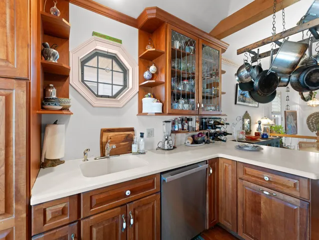 a kitchen with a sink and a stove