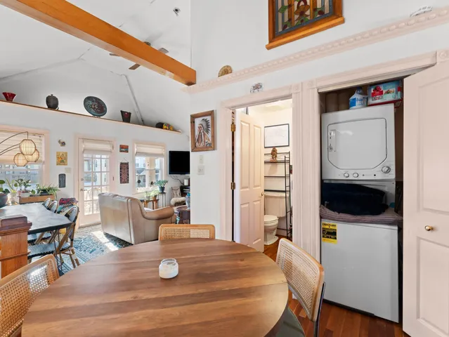 a kitchen with a dining table and chairs
