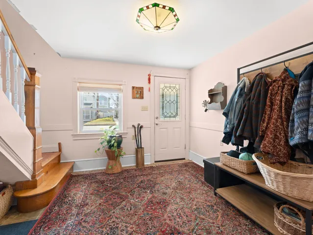 a view of a livingroom with furniture and a window