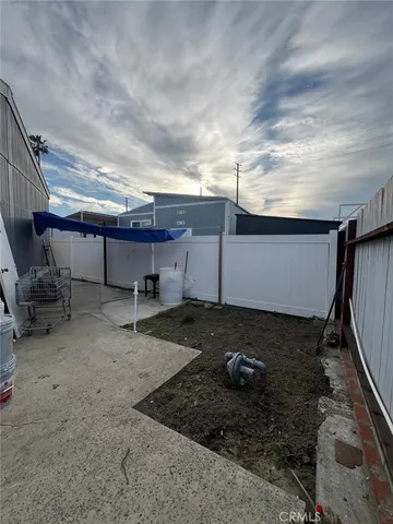 a view of a chairs and table in patio