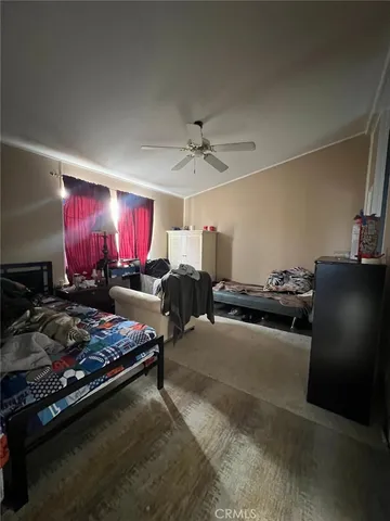 a kitchen with stainless steel appliances granite countertop a stove top oven a sink dishwasher and cabinets with wooden floor