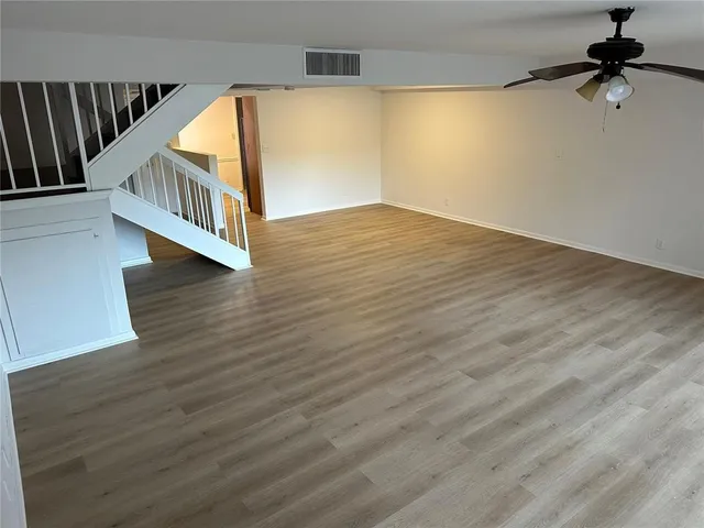 a view of an entryway with wooden floor