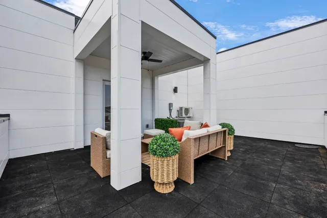 a view of sitting area in back yard of the house