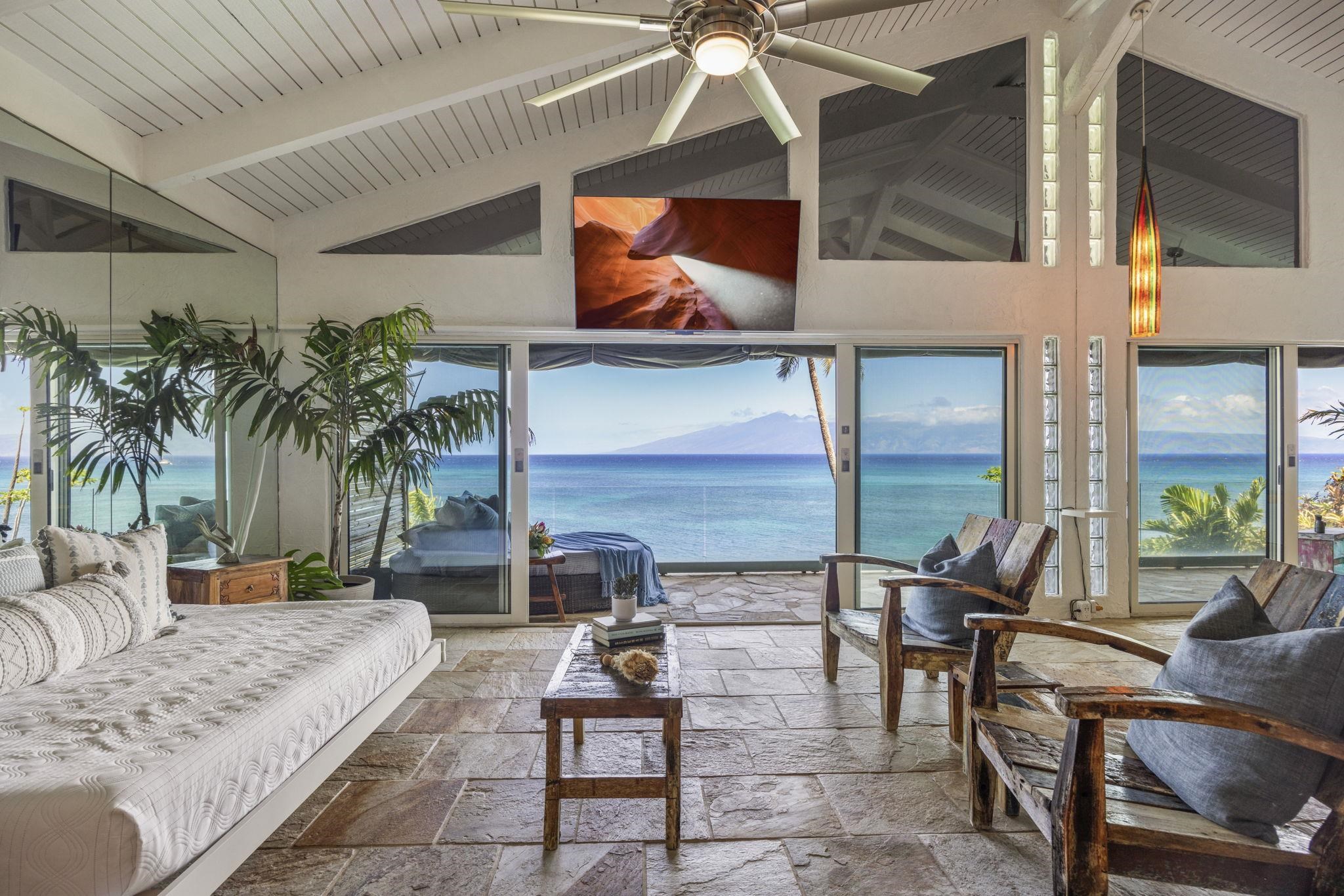 5171 Lower Honoapiilani Road Lahaina, HI 96761 - Photo 16 of 48 a living room with patio furniture and a potted plants