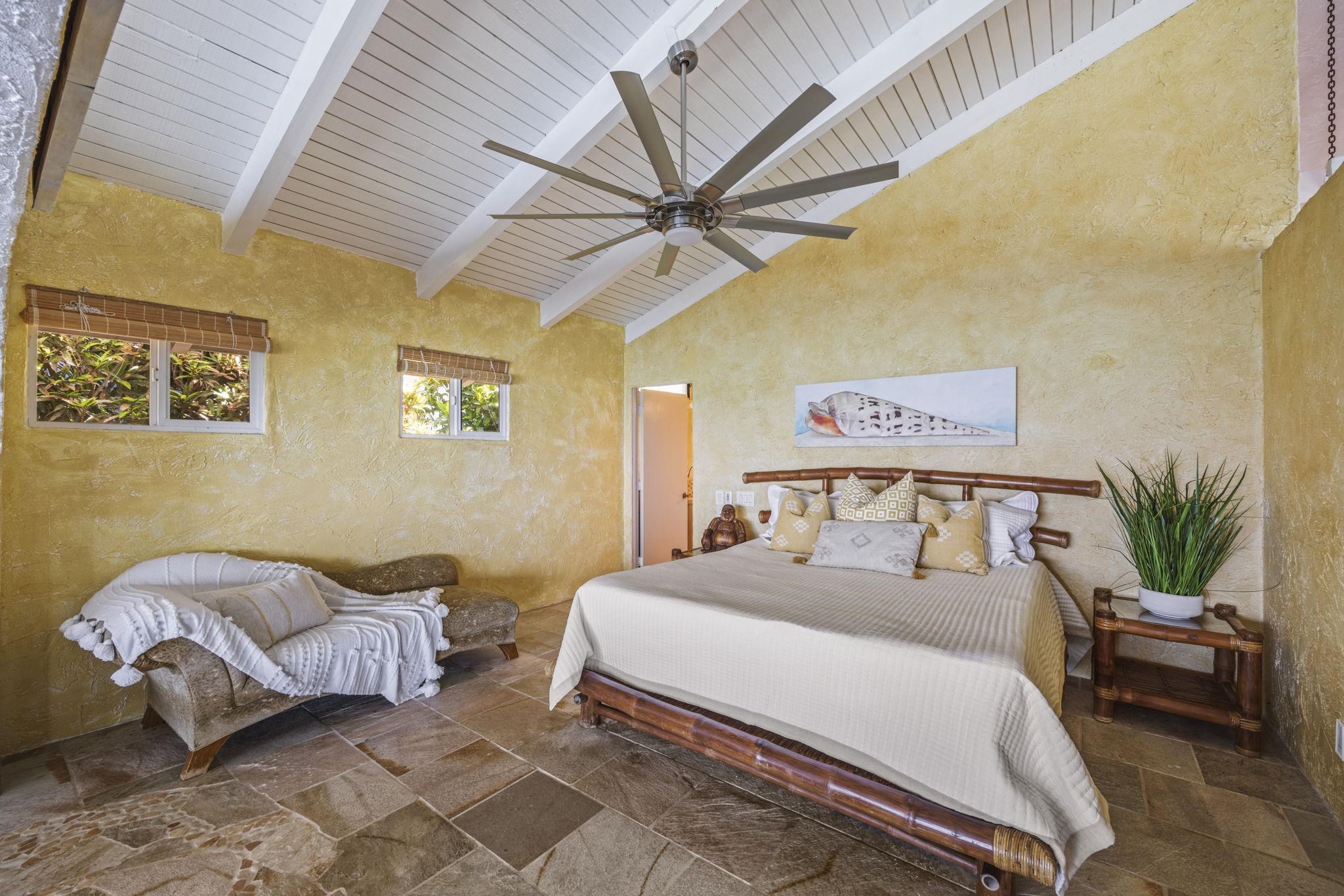 5171 Lower Honoapiilani Road Lahaina, HI 96761 - Photo 17 of 48 a bedroom with a bed and furniture