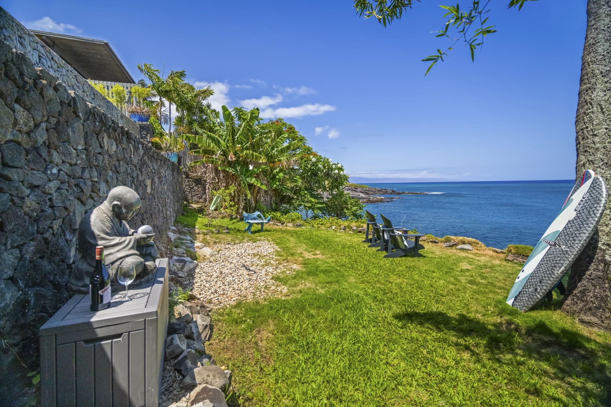 5171 Lower Honoapiilani Road Lahaina, HI 96761 - Photo 30 of 48 a backyard of a house with lots of green space