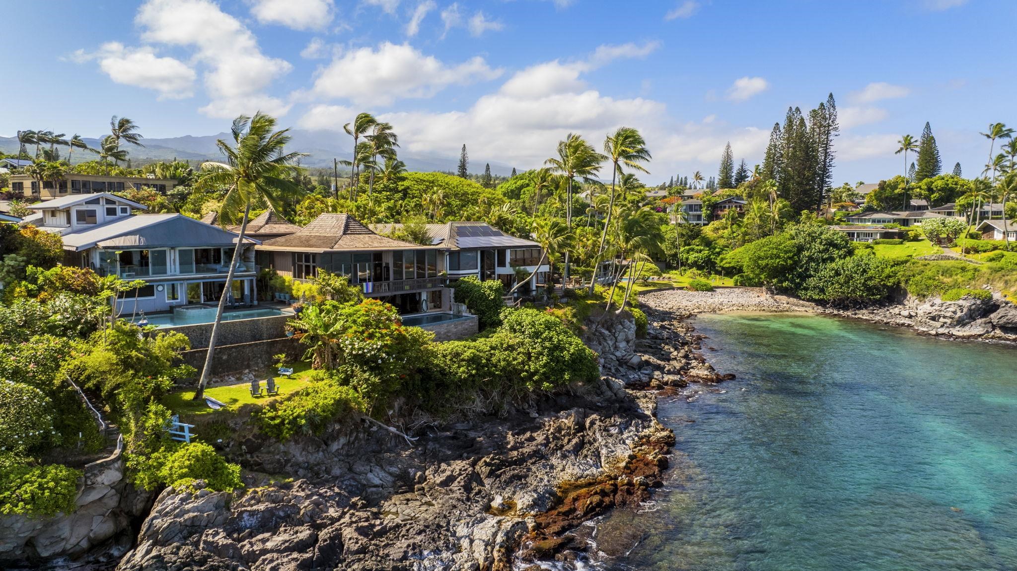 5171 Lower Honoapiilani Road Lahaina, HI 96761 - Photo 3 of 48 a view of a lake with a building in the background