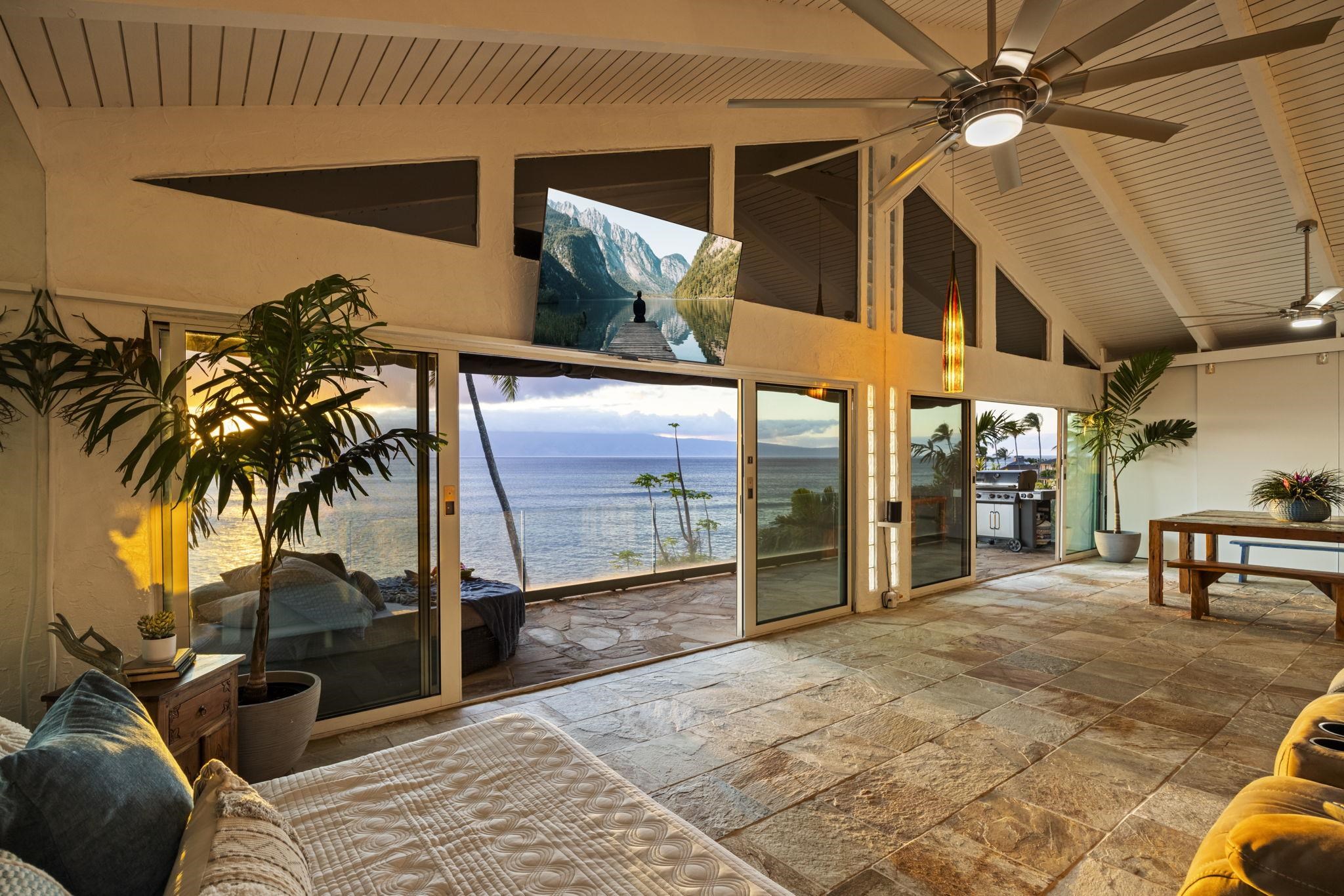 5171 Lower Honoapiilani Road Lahaina, HI 96761 - Photo 40 of 48 a view of a porch with a table and chairs