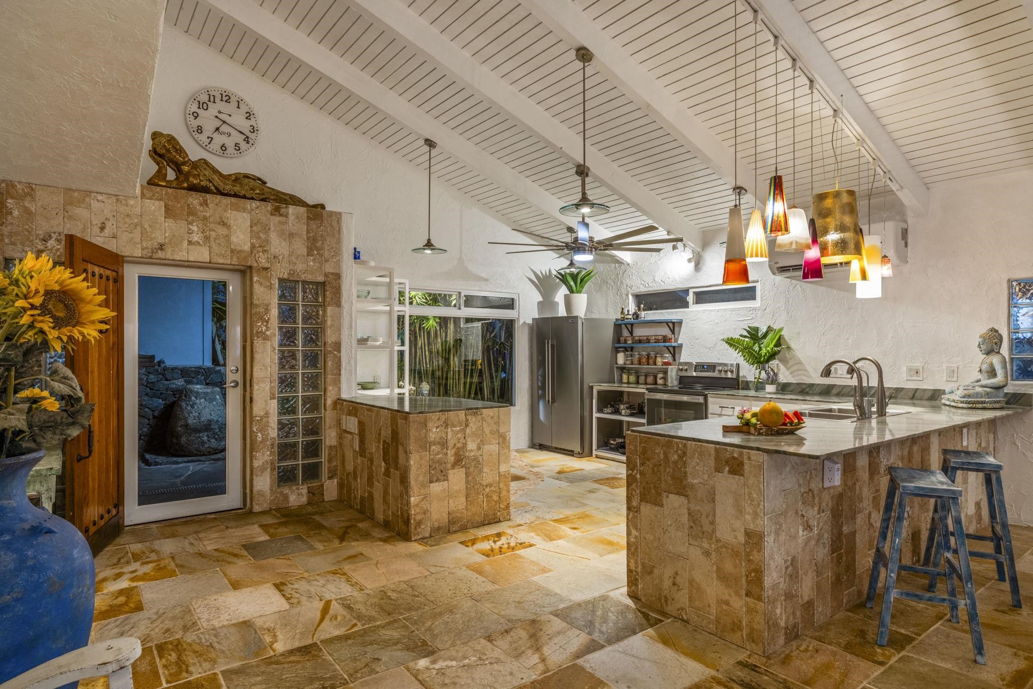 5171 Lower Honoapiilani Road Lahaina, HI 96761 - Photo 44 of 48 a living room with a sink and potted plants