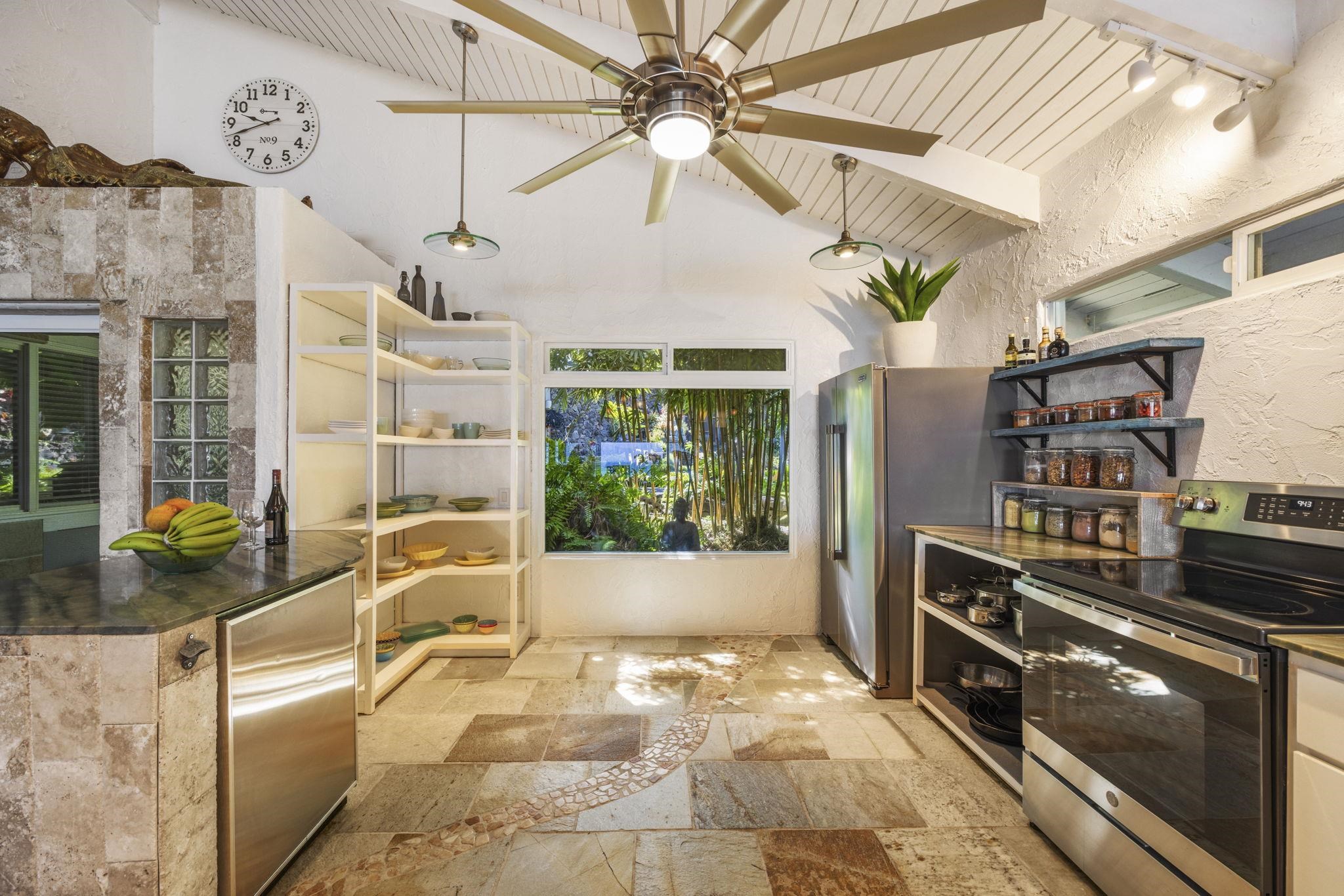 5171 Lower Honoapiilani Road Lahaina, HI 96761 - Photo 8 of 48 a very nice looking room with a large window and potted plants