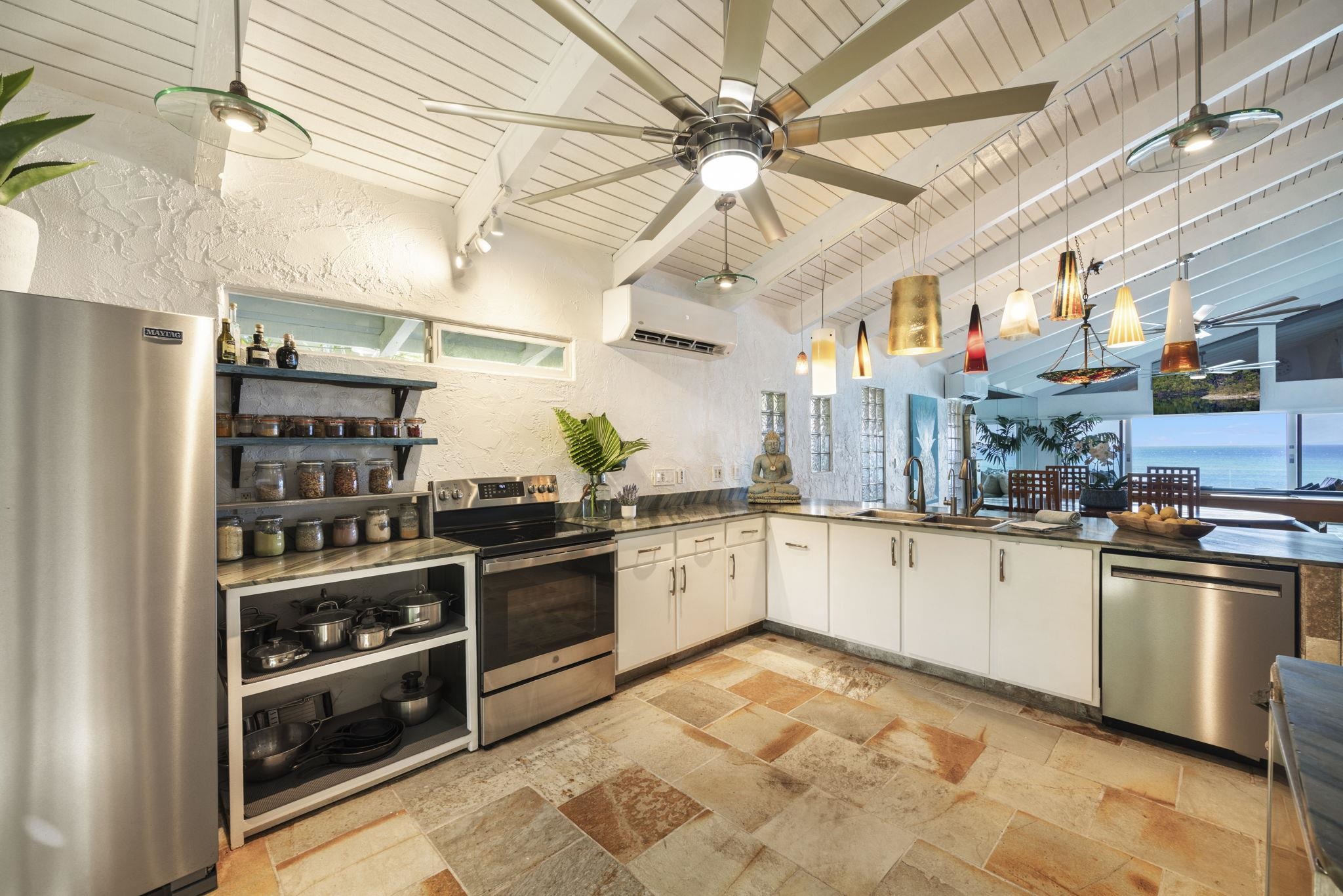 5171 Lower Honoapiilani Road Lahaina, HI 96761 - Photo 10 of 48 a kitchen with stainless steel appliances granite countertop a stove and a refrigerator