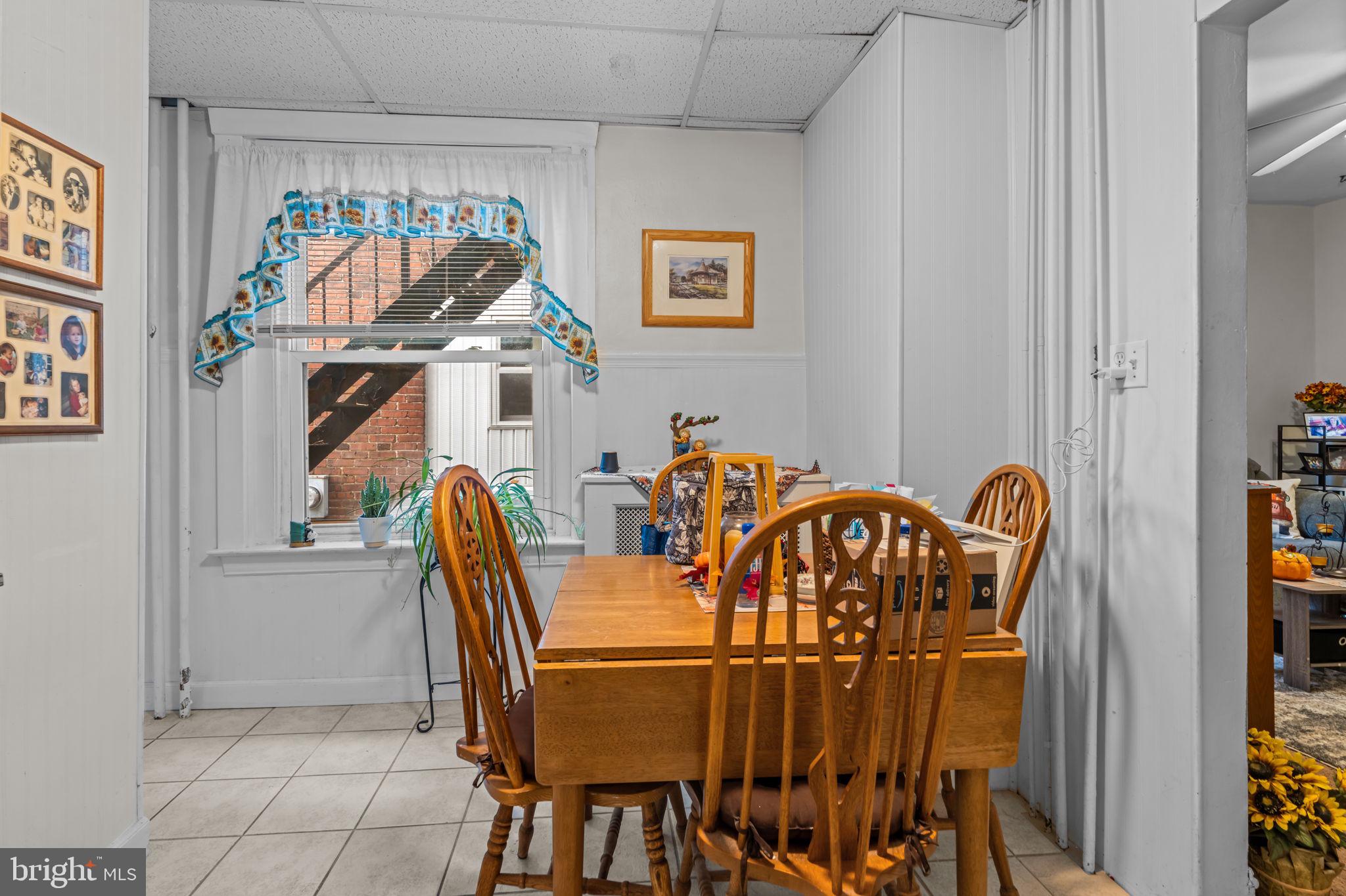 129 5th Lansdale, PA 19446 - Photo 6 of 8 a dining room with furniture and a chandelier
